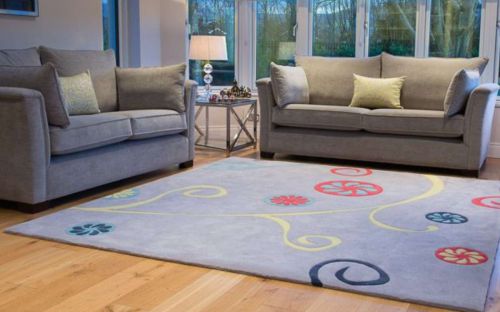 Hand tufted grey rug with colourful abstract floral design 