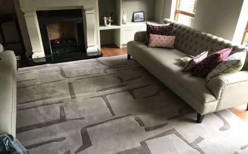 Hand tufted beige and brown rug