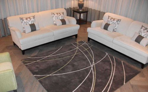 Hand tufted brown rug with overlapping arcing lines