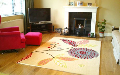 Hand tufted cream rug with colourful floral design