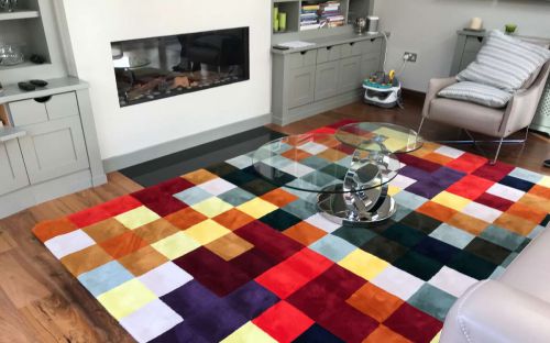 Hand tufted rug with colourful squares