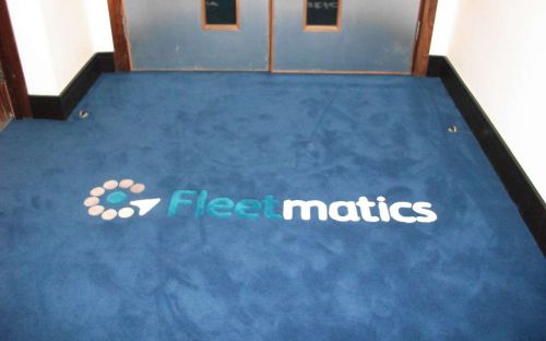 Hand tufted corridor carpet with Fleetmatics company logo