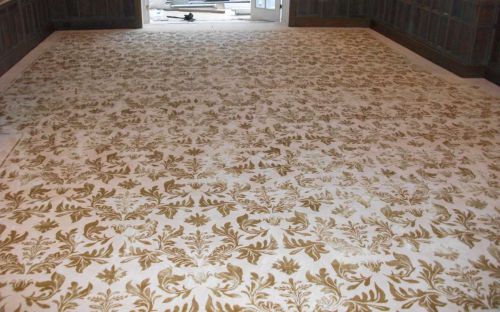 Hand tufted cream carpet with gold floral print all over
