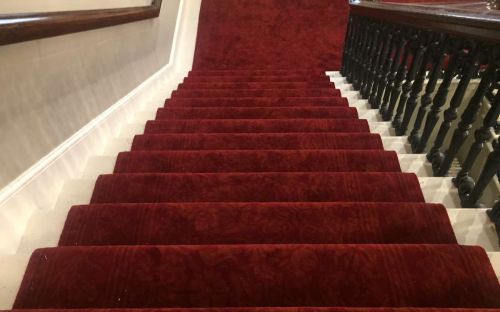 Red Handtufted carpet with subtle red allover pattern