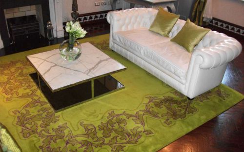 Hand tufted Green rug with floral design