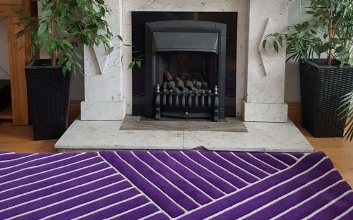 Hand tufted purple rug with white trellis design
