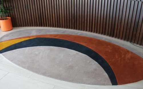 Hand tufted rug in corporate waiting area